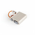 White electronic device with orange cable on a white background